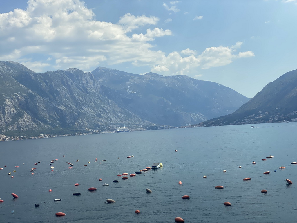 Boats at the Bay of Kotor and the towns of Donji Stoliv and Prcanj, viewed from the tour bus on the E65 road at the town of Drain Vrt