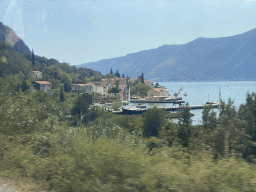 Houses and harbour at the town of Ljuta, viewed from the tour bus on the E65 road