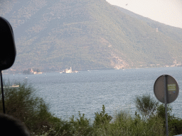 The Bay of Kotor with the Our Lady of the Rocks Island and the Saint George Island, viewed from the tour bus on the E65 road just northeast of the town of Strp