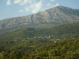 Hills and houses just northwest of the town of Igalo, viewed from the tour bus on the E65 road