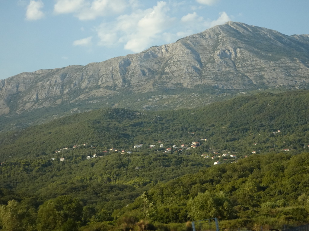 Hills and houses just northwest of the town of Igalo, viewed from the tour bus on the E65 road