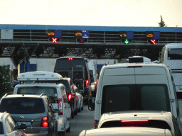 Cars waiting in line for the Montenegro-Croatia border crossing near the town of Sutorina, viewed from the tour bus on the E65 road