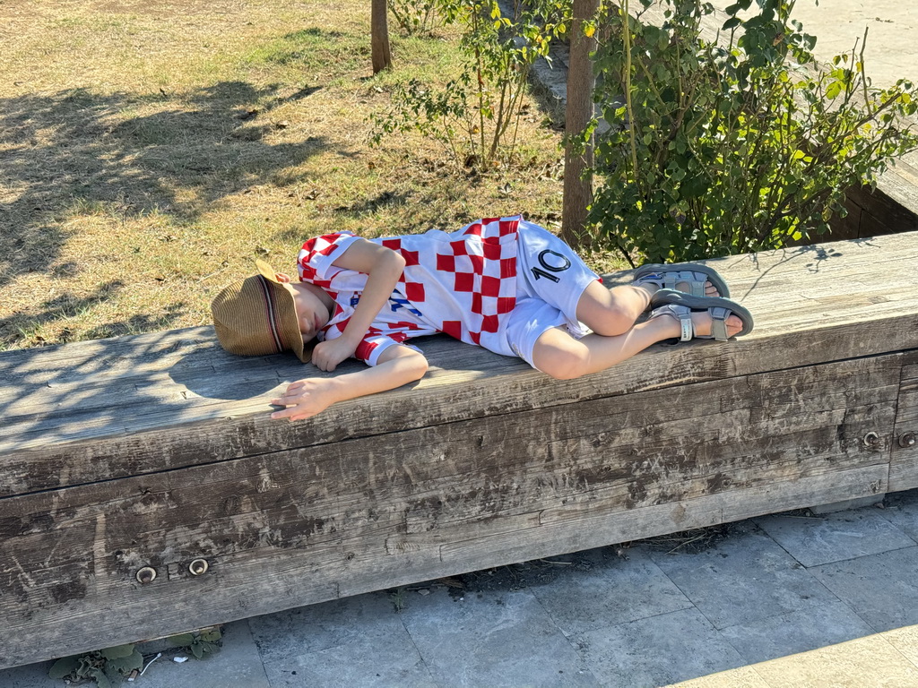 Max on a bench next to the parking lot of the Ancient City of Perge