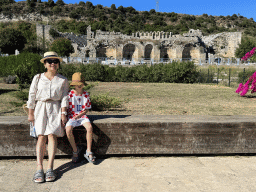 Miaomiao and Max at the entrance to the Ancient City of Perge, with a view on the east side of the Roman Theatre of Perge
