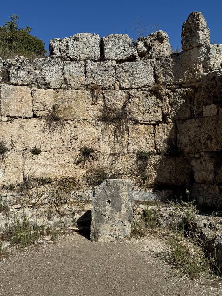 Rock with inscription at the north side of the Claudius Peison Gallery of the Southern Bath at the Ancient City of Perge