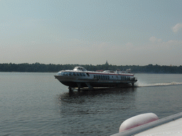 Hydrofoil in the Gulf of Finland and the towers of the St. Peter and Paul Cathedral, viewed from the hydrofoil from Saint Petersburg