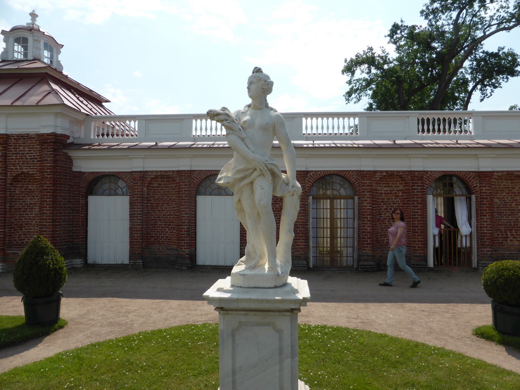 Miaomiao and a statue at the back side of the Monplaisir Palace