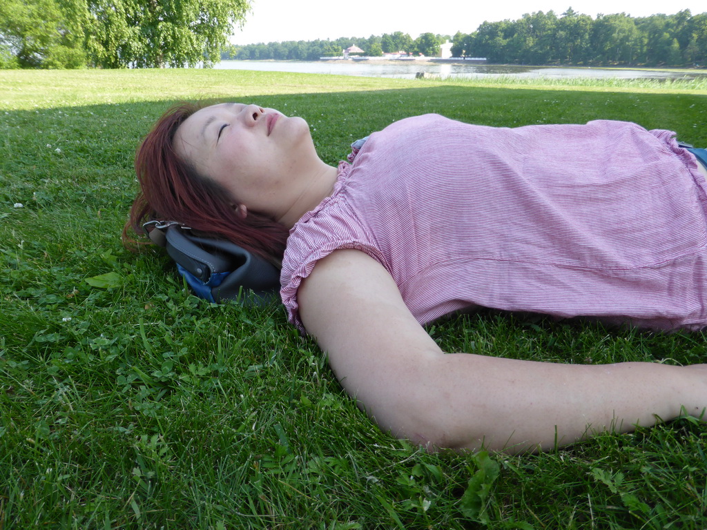 Miaomiao lying down in the garden in front of the Imperial Yacht Museum