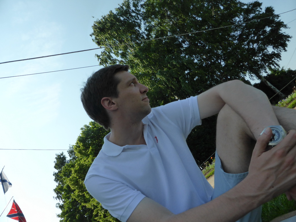 Tim sitting down in the garden in front of the Imperial Yacht Museum