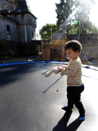 Max at the trampoline at the playground of the Castle of Petite-Somme