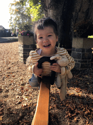 Max on the seesaw at the playground of the restaurant of the Castle of Petite-Somme