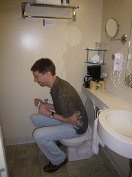 Tim on the toilet of our room in the Club Quarters in Philadelphia hotel