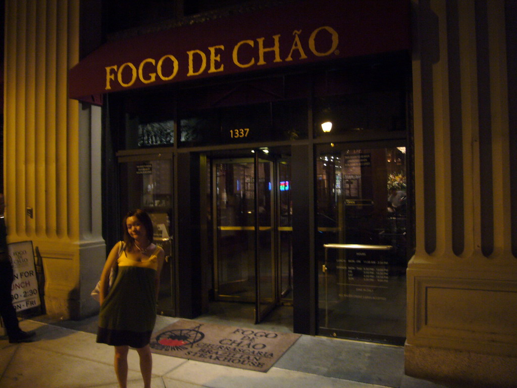 Miaomiao in front of the Brazilian restaurant `Fogo de Chão`, by night