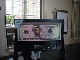 Tim in a giant 5 dollar bill in the Independence Visitor Center