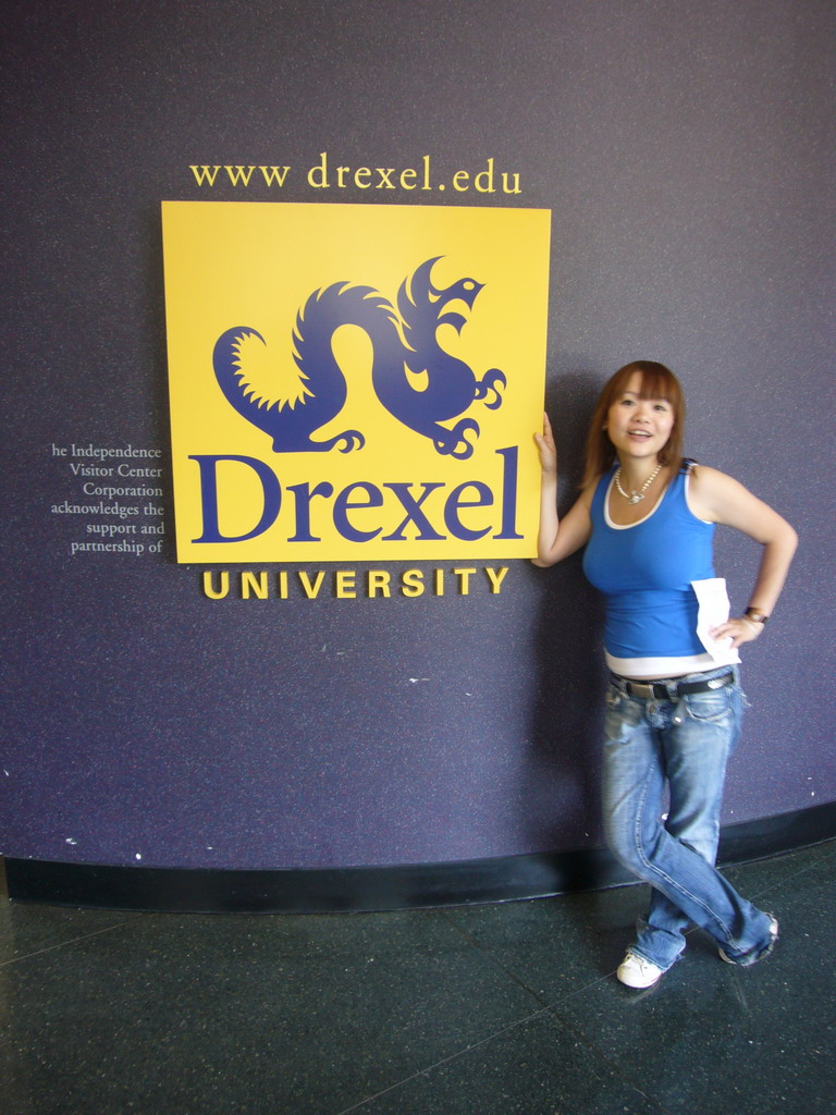 Miaomiao with a sign of Drexel University in the Independence Visitor Center