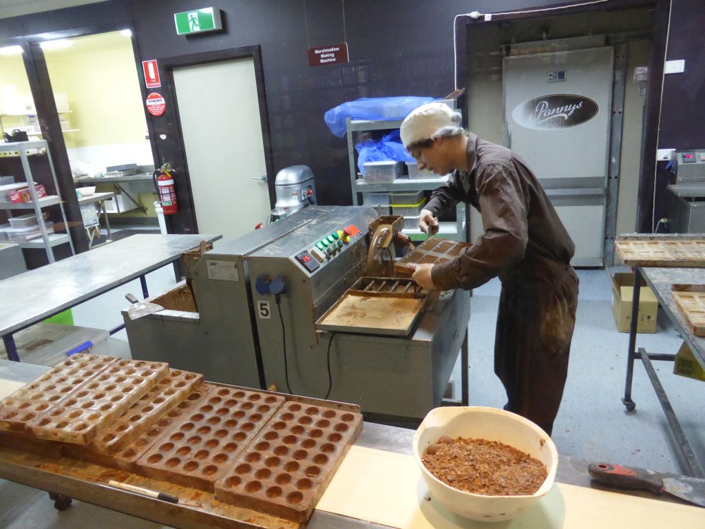Factory worker making chocolates, at the Phillip Island Chocolate Factory