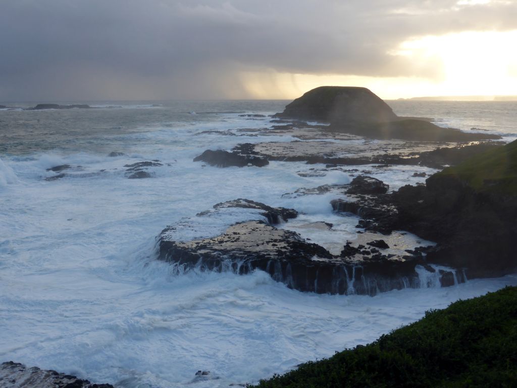 Round Island, the Seal Rocks and cliffs at the Bass Strait, viewed from the Nobbies Boardwalk