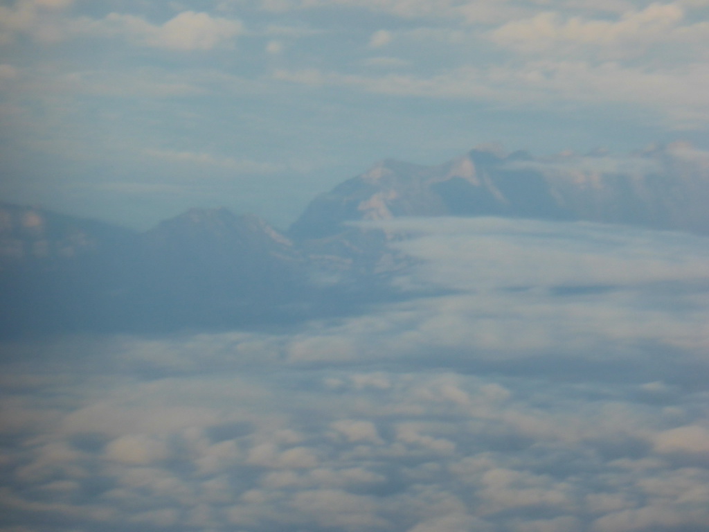 View on the Alps mountains, from the plane from Eindhoven