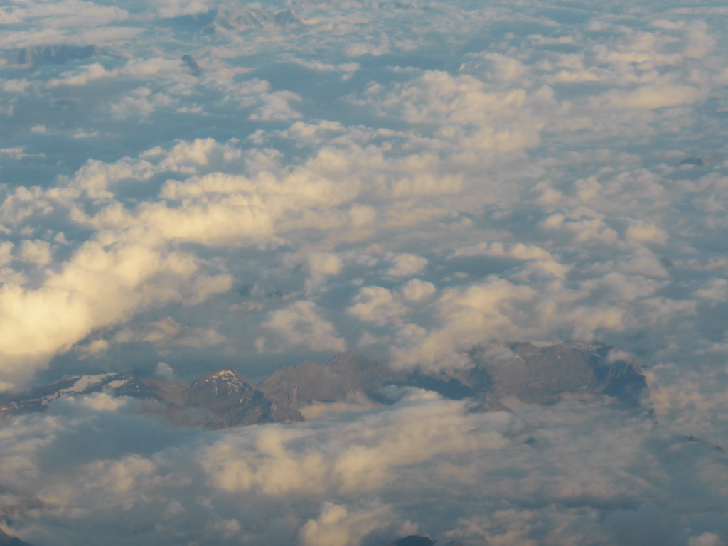 View on the Alps mountains, from the plane from Eindhoven