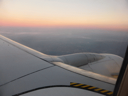 The left wing of our Ryanair airplane, with a view on the north of Italy