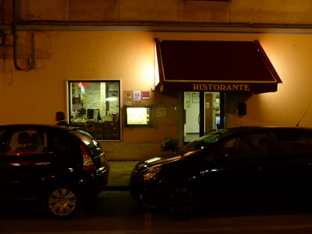 Front of the La Buca restaurant at the Via Massimo D`Azeglio street, by night