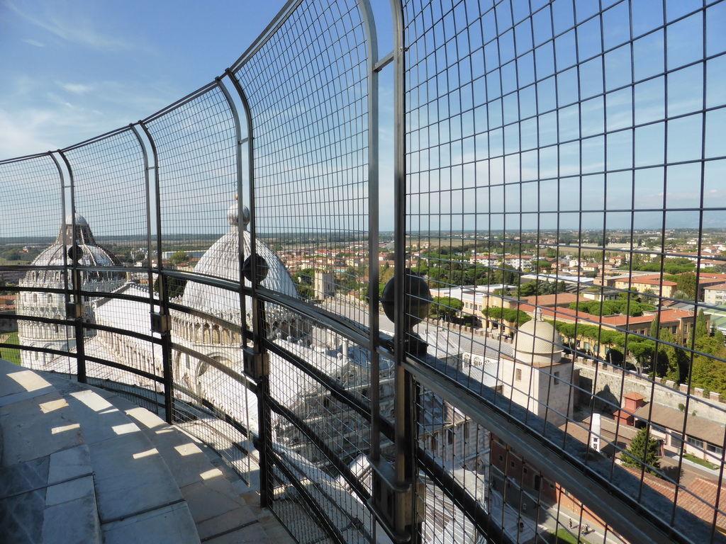 The top floor of the Leaning Tower of Pisa and a view on the Pisa Duomo cathedral, the Baptistry of St. John, the Camposanto Monumentale cemetery, the City Wall and the northwest side of the city