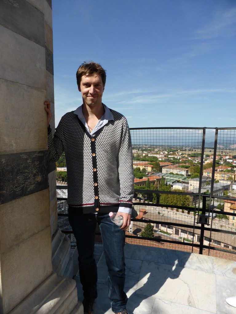Tim at the top floor of the Leaning Tower of Pisa, with a view on the north side of the city