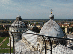 The top floor of the Leaning Tower of Pisa and a view on the Piazza del Duomo square with the Pisa Duomo cathedral, the Baptistry of St. John, the City Wall and the west side of the city