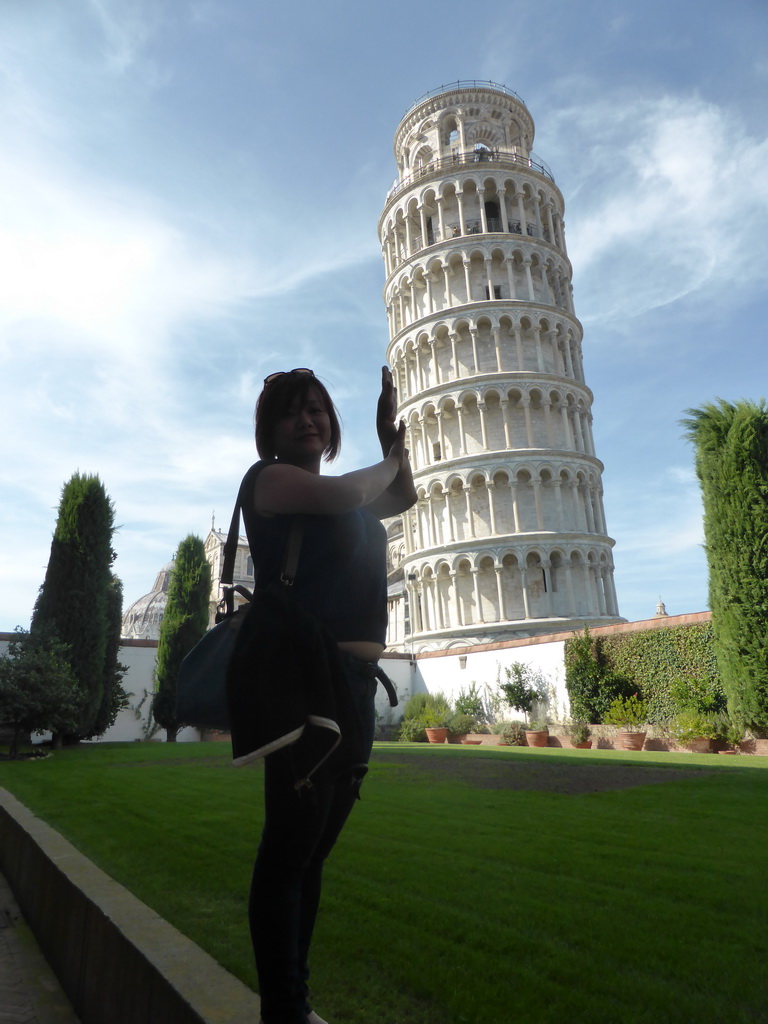 Miaomiao at the Garden of the Museo dell`Opera del Duomo museum with a view on the Leaning Tower of Pisa