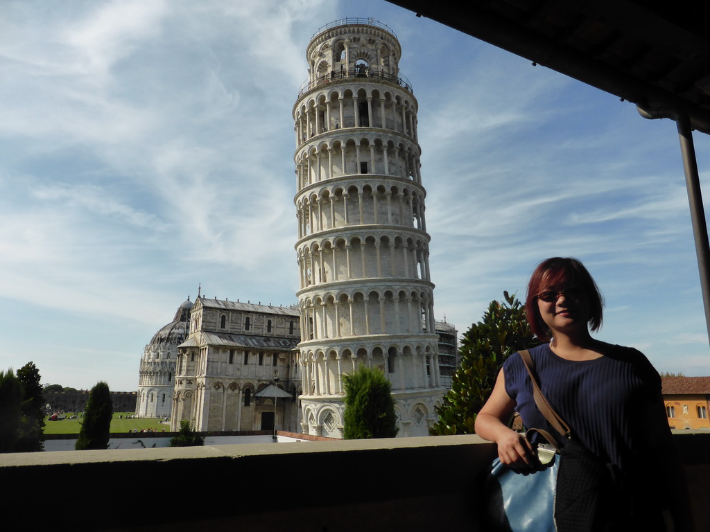 Miaomiao at the upper floor of the Museo dell`Opera del Duomo museum with a view on the Baptistry of St. John, the Pisa Duomo cathedral and the Leaning Tower of Pisa