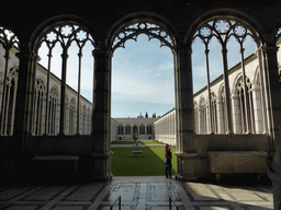 Miaomiao at the arch leading to the inner courtyard of the Camposanto Monumentale cemetery