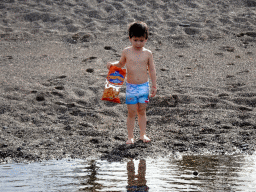 Max with a bag of chips at the Playa Honda beach