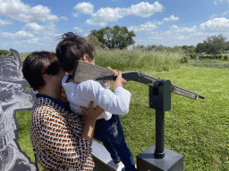 Miaomiao and Max playing the musket shooting game at Loevestein Castle