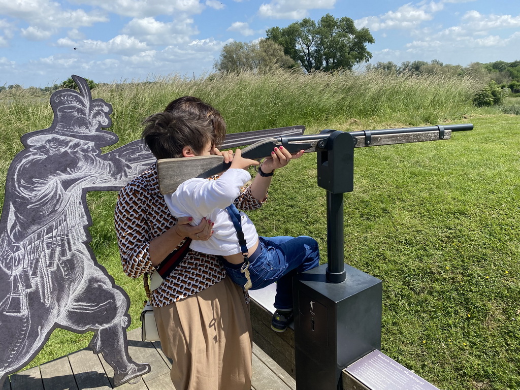 Miaomiao and Max playing the musket shooting game at Loevestein Castle