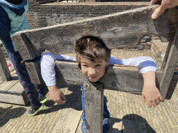 Max in a pillory in front of the southeast side of Loevestein Castle