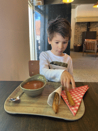 Max having tomato soup and bread at the Taveerne restaurant at Loevestein Castle