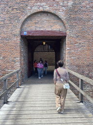 Miaomiao walking over the bridge at the southeast side of Loevestein Castle