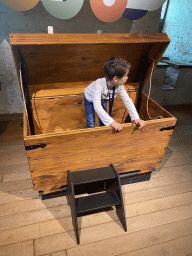 Max in a book chest at the 400 Years Hugo de Groot exhibition at the Middle Floor of Loevestein Castle