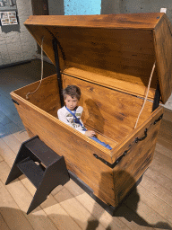 Max in a book chest at the 400 Years Hugo de Groot exhibition at the Middle Floor of Loevestein Castle