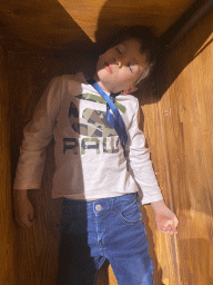 Max in a book chest at the 400 Years Hugo de Groot exhibition at the Middle Floor of Loevestein Castle