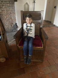 Max on a chair at the Hall at the Middle Floor of Loevestein Castle