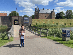 Miaomiao and Max at the northwest side of Loevestein Castle and its entrance bridge and moat