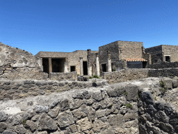 Walls and columns at the House of Romulus and Remus at the Pompeii Archeological Site, viewed from the Via Marina street