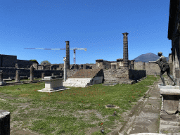 Courtyard, altar, walls and columns at the Temple of Apollo at the Pompeii Archeological Site, with a view on Mount Vesuvius