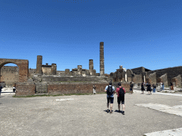 The Arch of Augustus and walls and columns at the Temple of Jupyter at the Forum at the Pompeii Archeological Site
