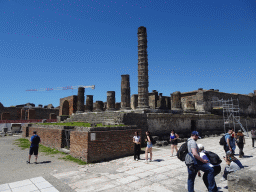 The Arch of Augustus and walls and columns at the Temple of Jupyter at the Forum at the Pompeii Archeological Site