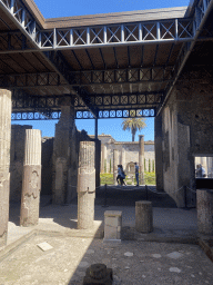 Columns and walls at the House of the Dioscuri at the Pompeii Archeological Site