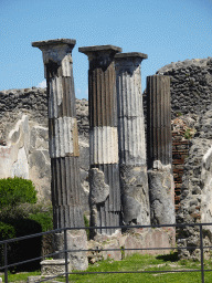 Columns and walls at the House of Meleagro at the Pompeii Archeological Site, viewed from the Via di Mercurio street