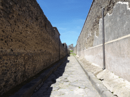 The Vicolo del Labirinto street with the Torre X tower at the Pompeii Archeological Site, viewed from the Vicolo di Mercurio street