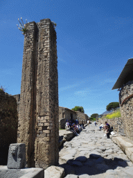 Column at the Via del Vesuvio street at the Pompeii Archeological Site, viewed from the Vicolo di Mercurio street